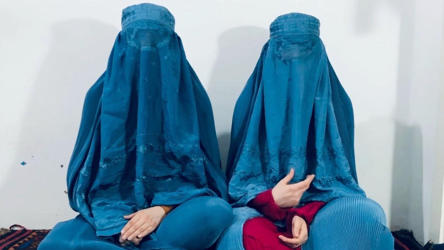 The two singers with burkas appear on a video