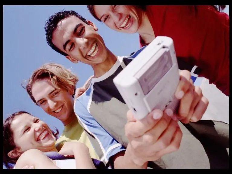 Young people smiling in an advert for gameboys