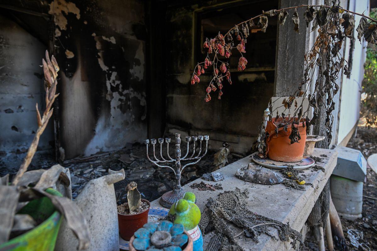 A Hanukkah menorah is left on a counter of a destroyed house after Hamas attacked this kibbutz on 7 October near the border of Gaza on 1 November 2023 in Kissufim, Israel. 