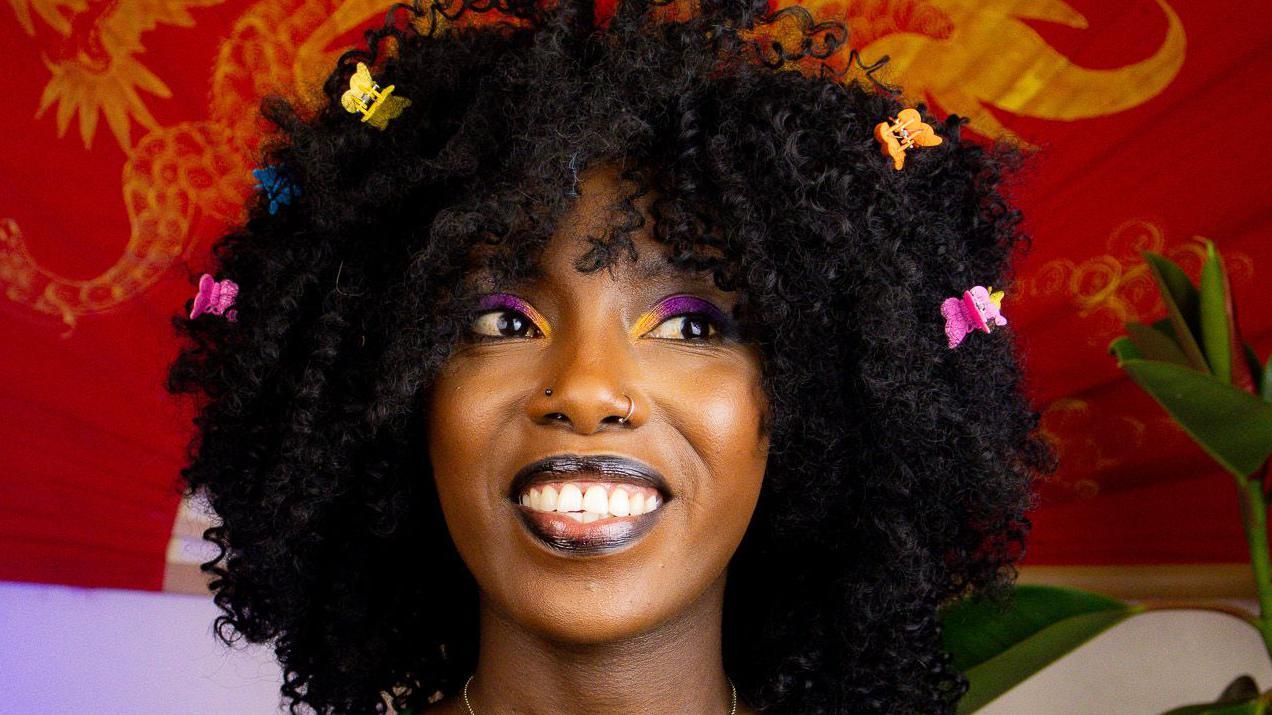 Muthoni Gitau sorrindo