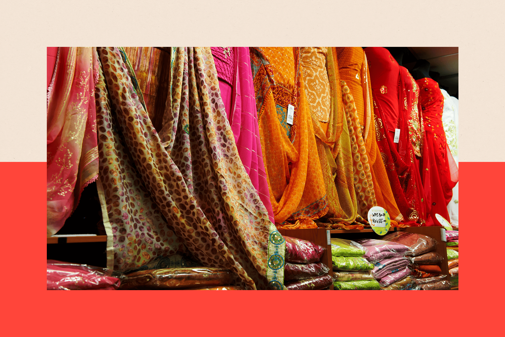 A row of traditional South Asian dresses in a store