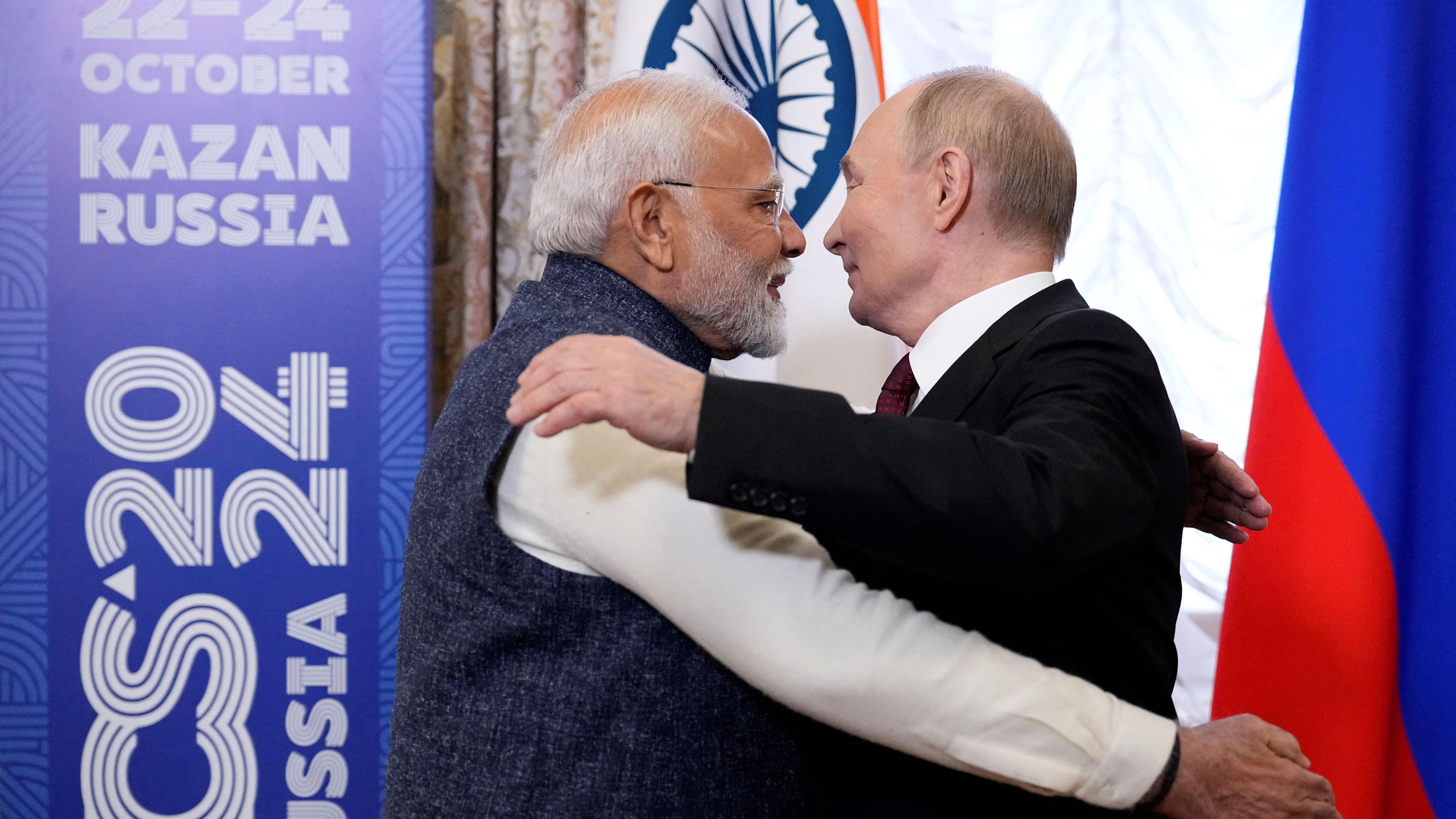 Indian Prime Minister Narendra Modi embraces Vladimir Putin