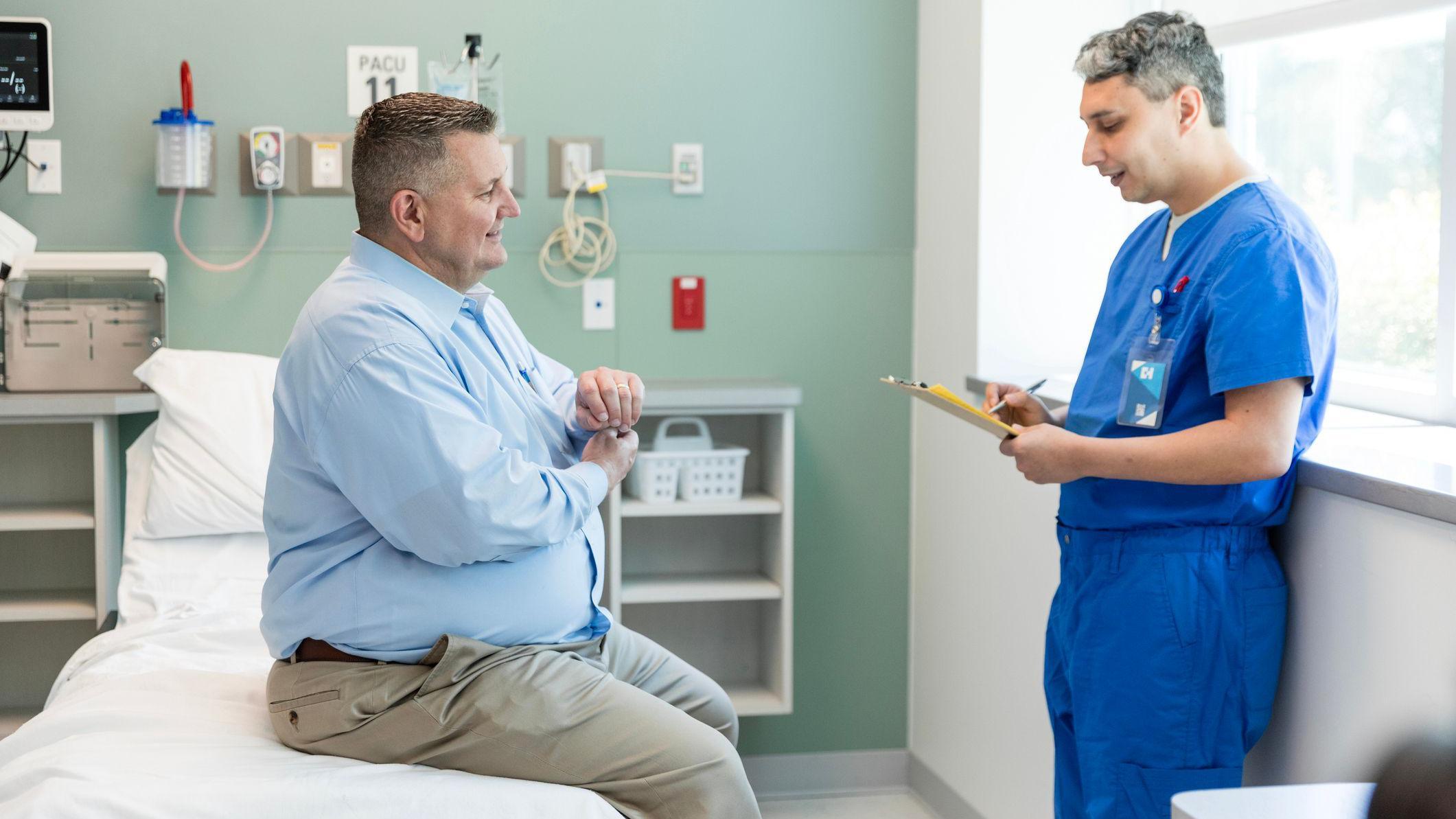 A doctor with an obese patient