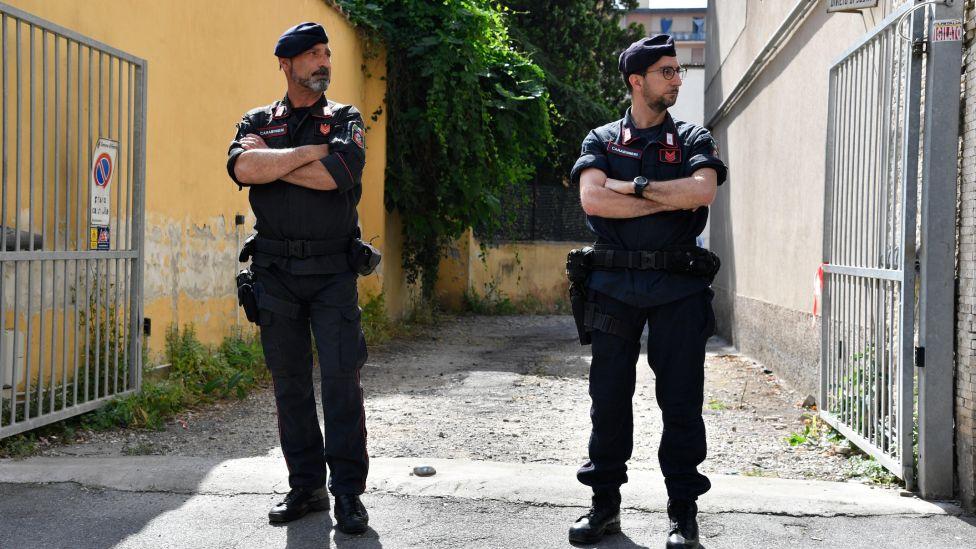 Italian police officers at the ex-hotel Astor