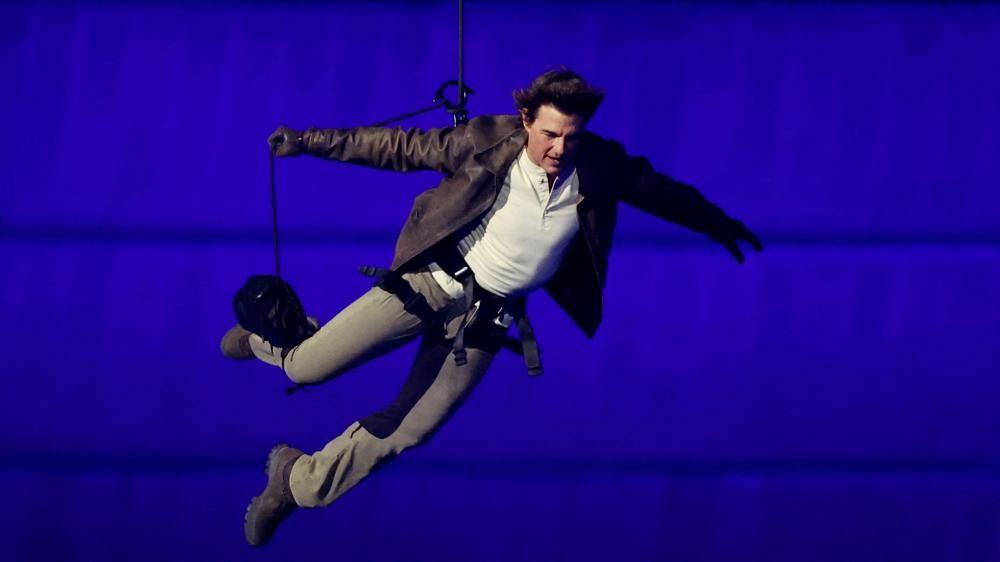 Tom Cruise descends from stadium roof in daring Olympic finale