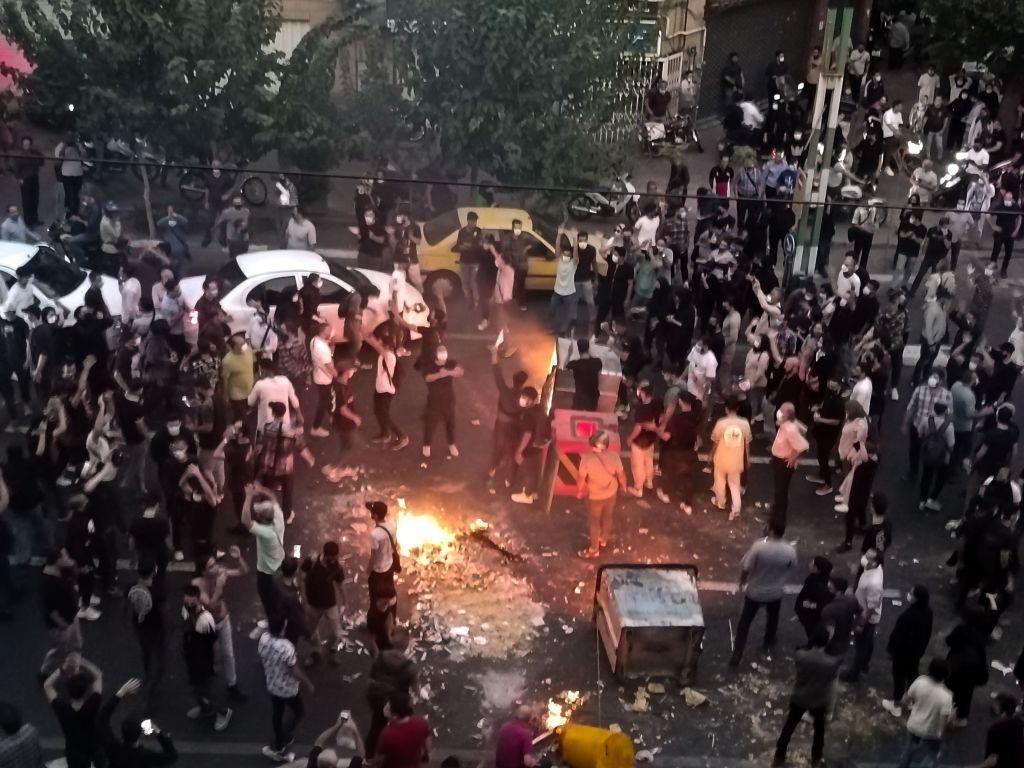 A view of protestors setting garbage bins on fire to block the roads during the protests. The nationwide protests started after the death of Mahsa Amini
