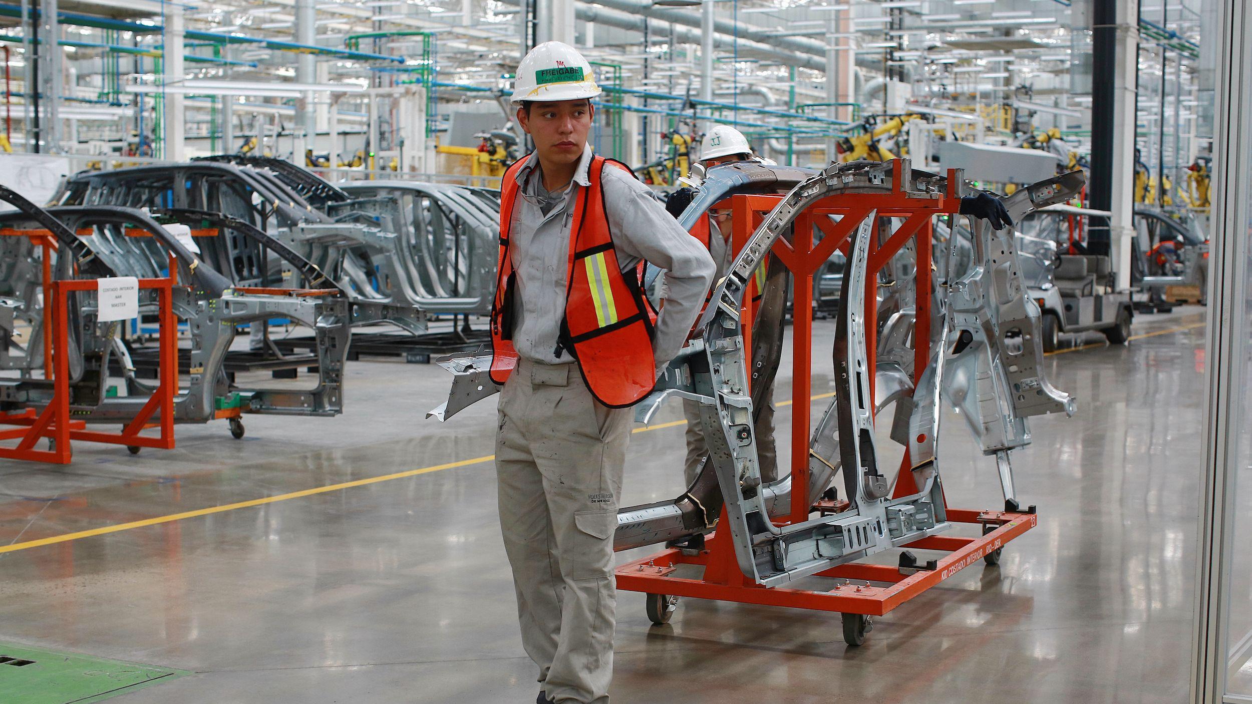 A worker on the floor of a VW plant in Mexico