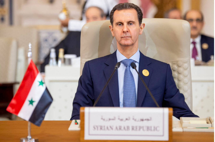 الرئيس السوري بشار الأسد أثناء حضوره اجتماعا طارئا للجامعة العربية ومنظمة التعاون الإسلامي في العاصمة السعودية الرياض.