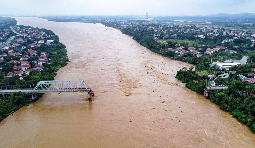 Cars plunge into river as super typhoon destroys Vietnam bridge