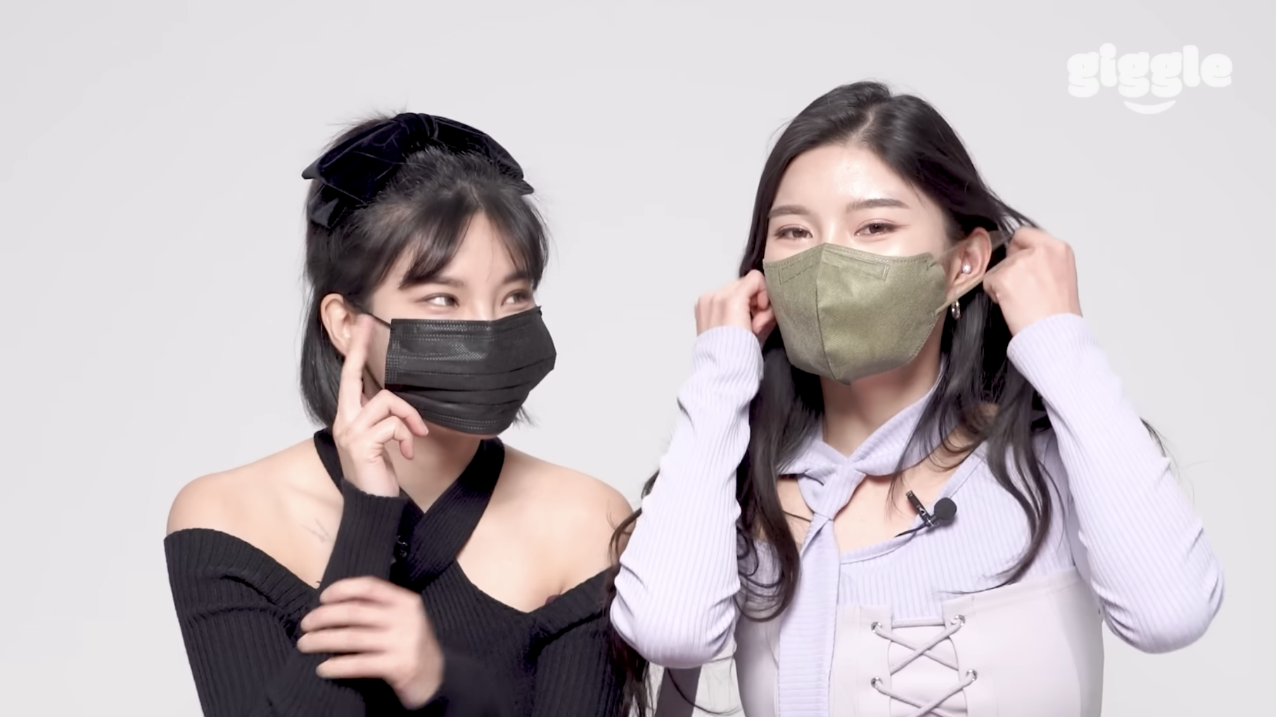 Two women with masks on