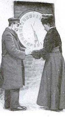 Ruth Belville ao lado de homem em frente a relógio