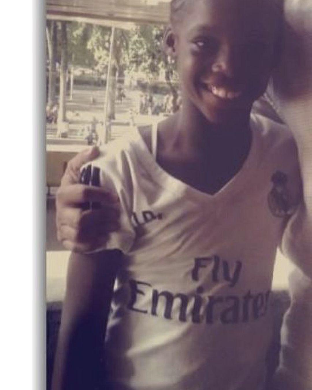 Linda Caicedo as the girl wearing a Real Madrid jersey.