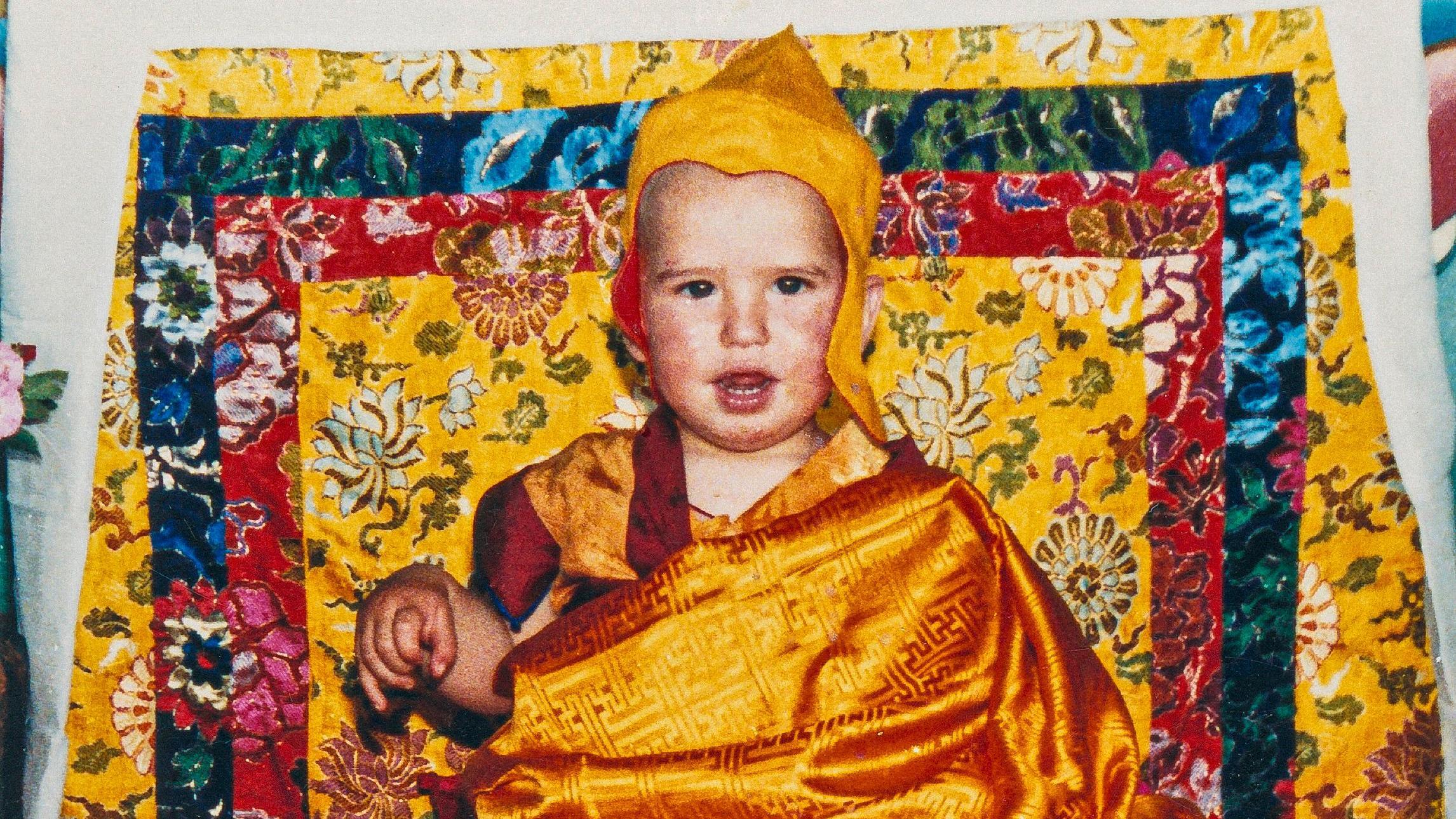 Osel Hita Torres as a child dressed in typical Buddhist monk attire.