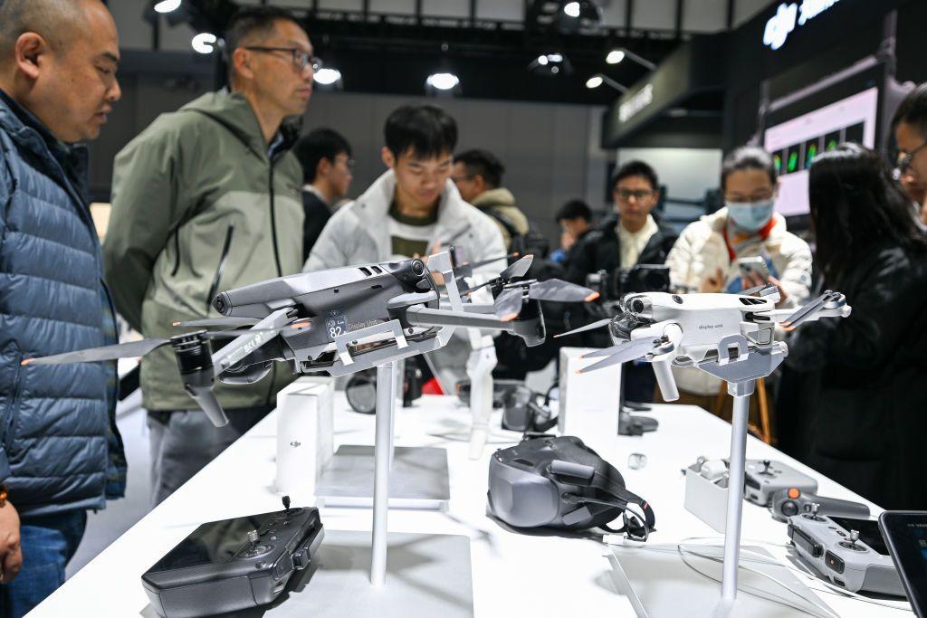 Visitors observe DJI drones at the World Intelligent Manufacturing Expo 2024 in Nanjing