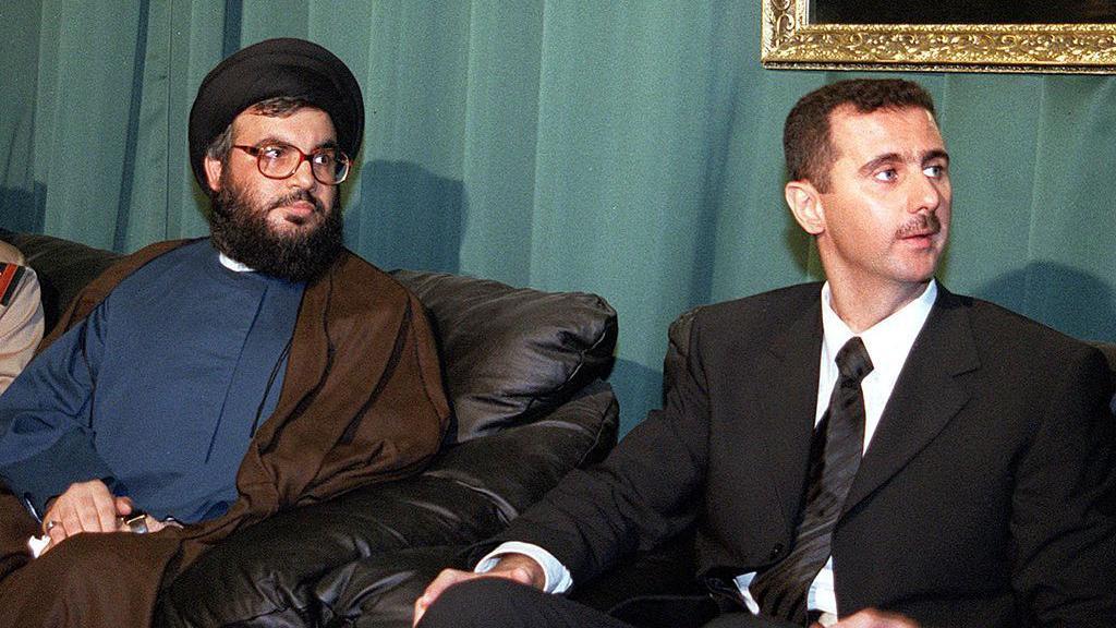 Hassan Nasrallah (kiri) dan Bashar al Assad 