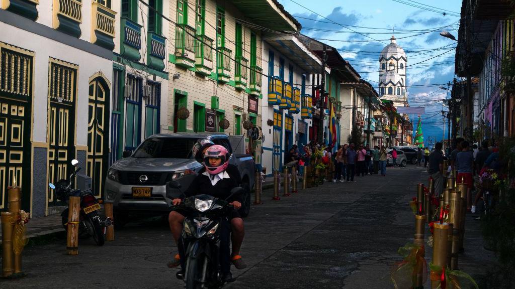 People on motorcycles on a street in Filandia, Quindío