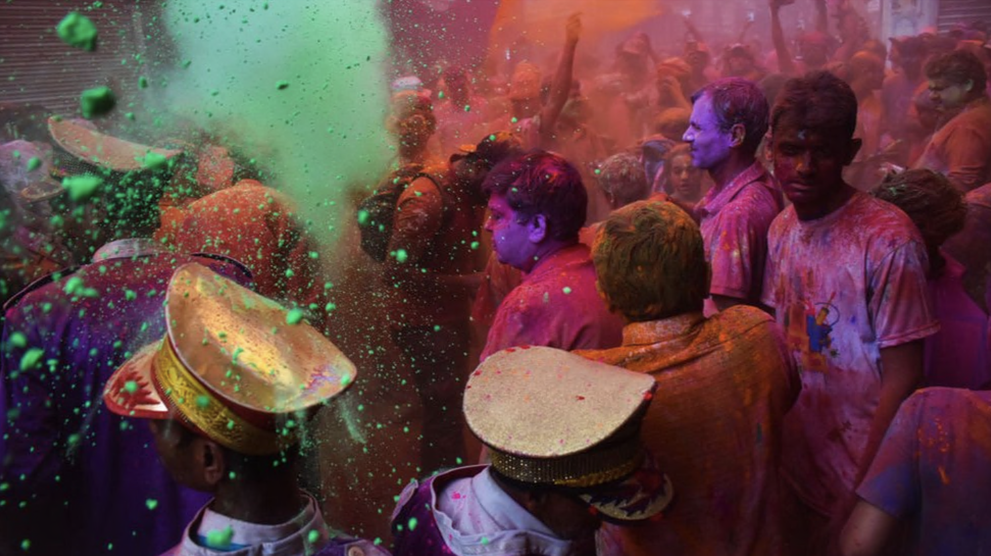 People daubed in colours celebrate Holi