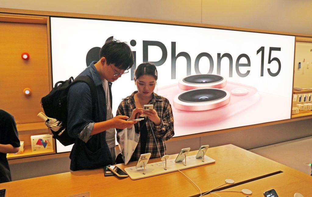 Customers are experiencing the newly launched iPhone 15 at Apple's flagship store in Shanghai, China, on September 24, 2023
