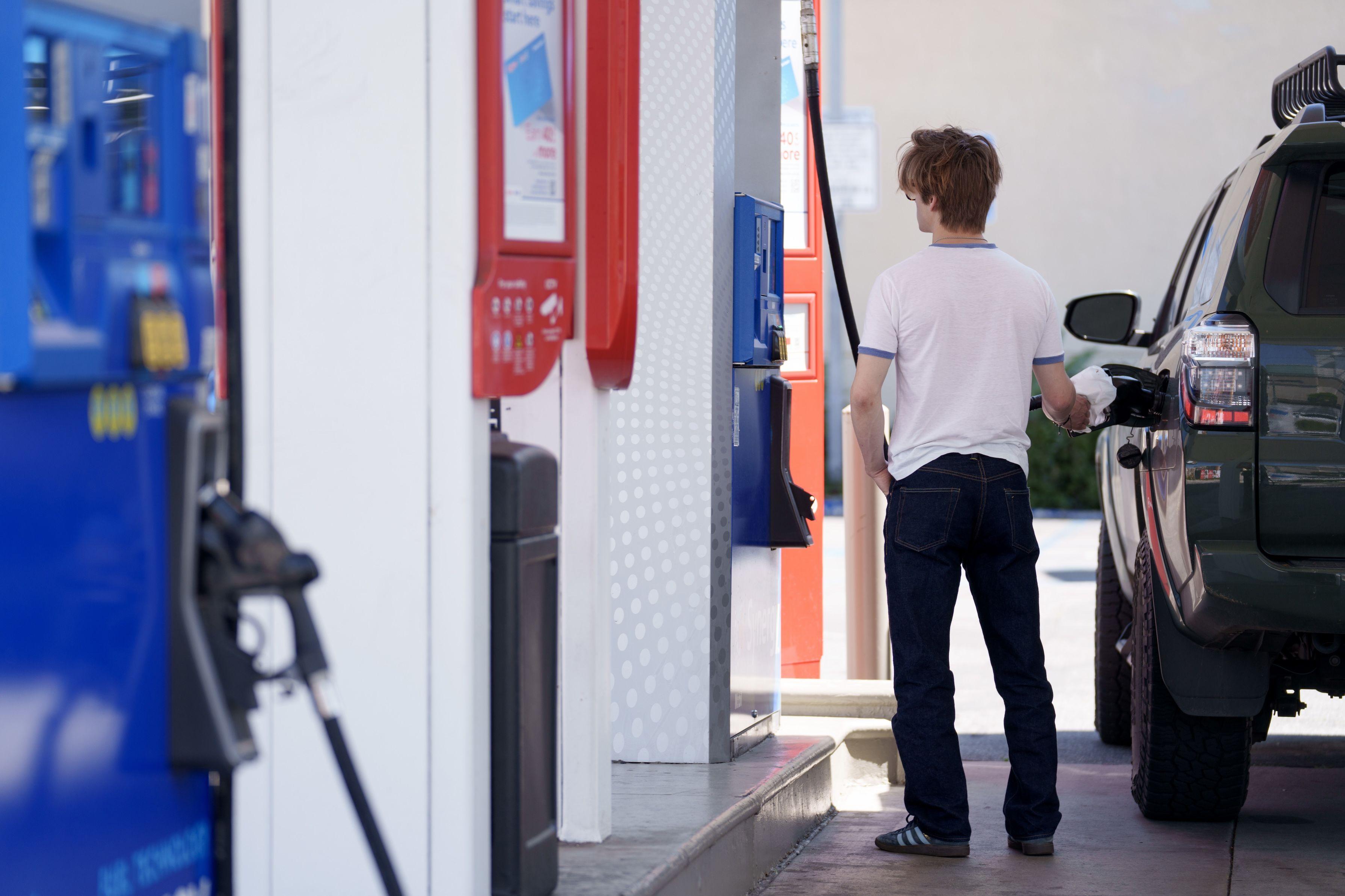 A customer refuels a vehicle at a Mobil gas station in Los Angeles, California, US, on Tuesday, April 2, 2024
