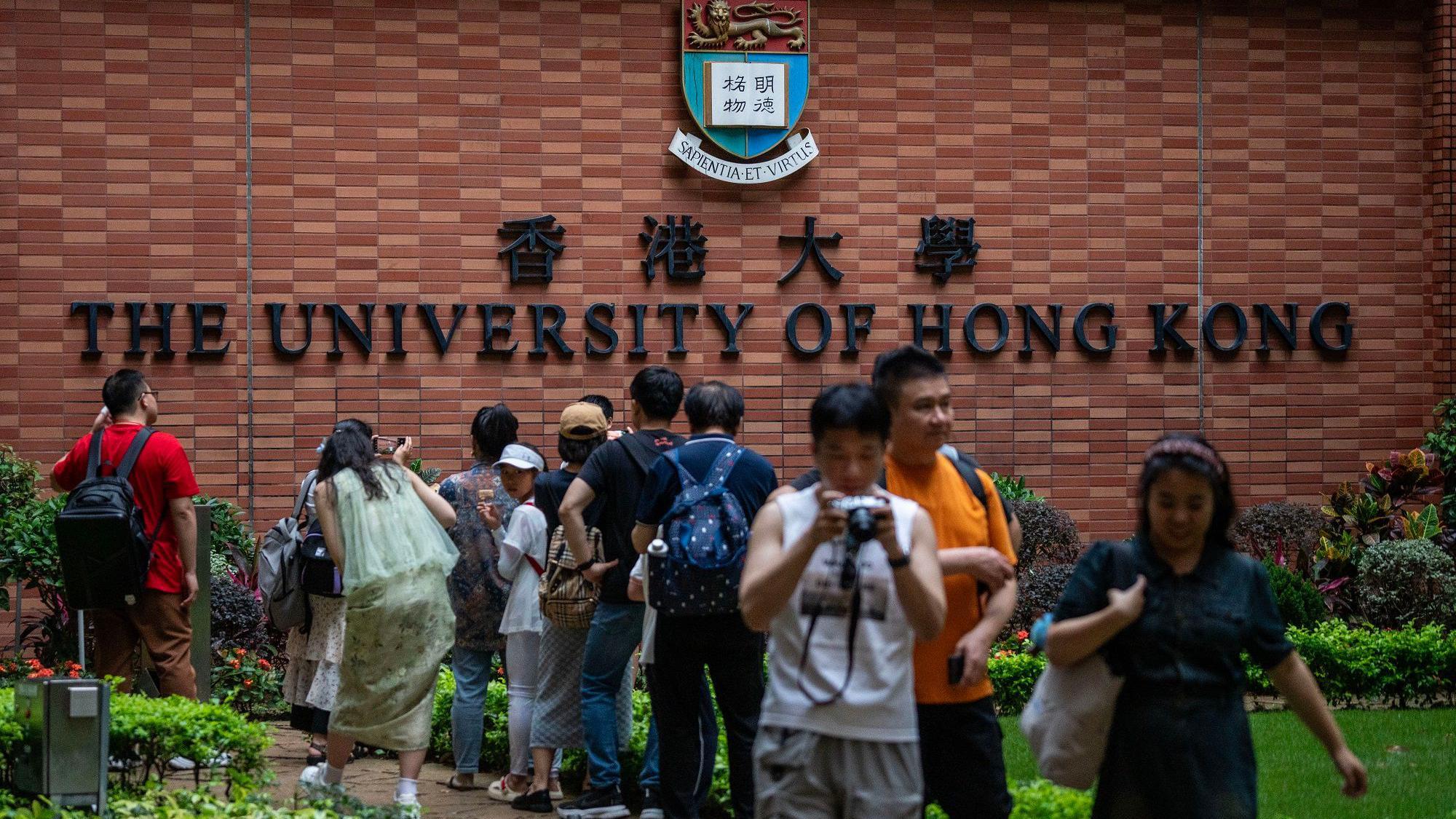 People are taking pictures with the University of Hong Kong sign in Hong Kong, on May 1, 2024