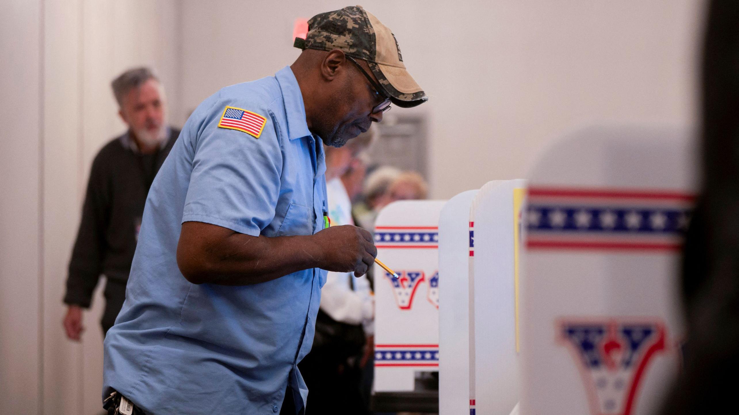 A man votes early in the US