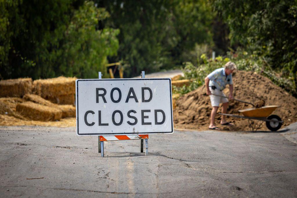 A resident of Rancho Palos Verdes collects soil moved by the constant landslide on the peninsula of Los Angeles County, California, United States, on September 1, 2024.