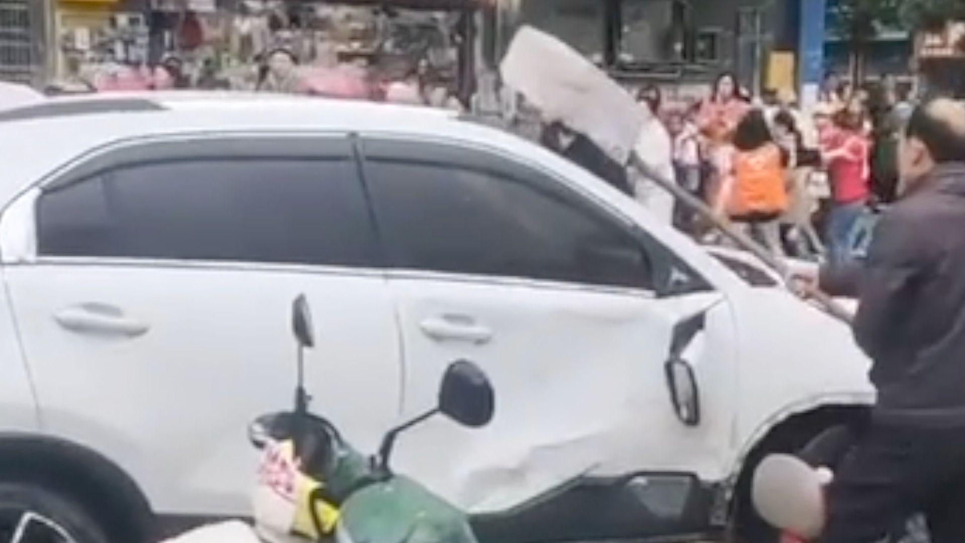 Car driven into crowd outside China primary school