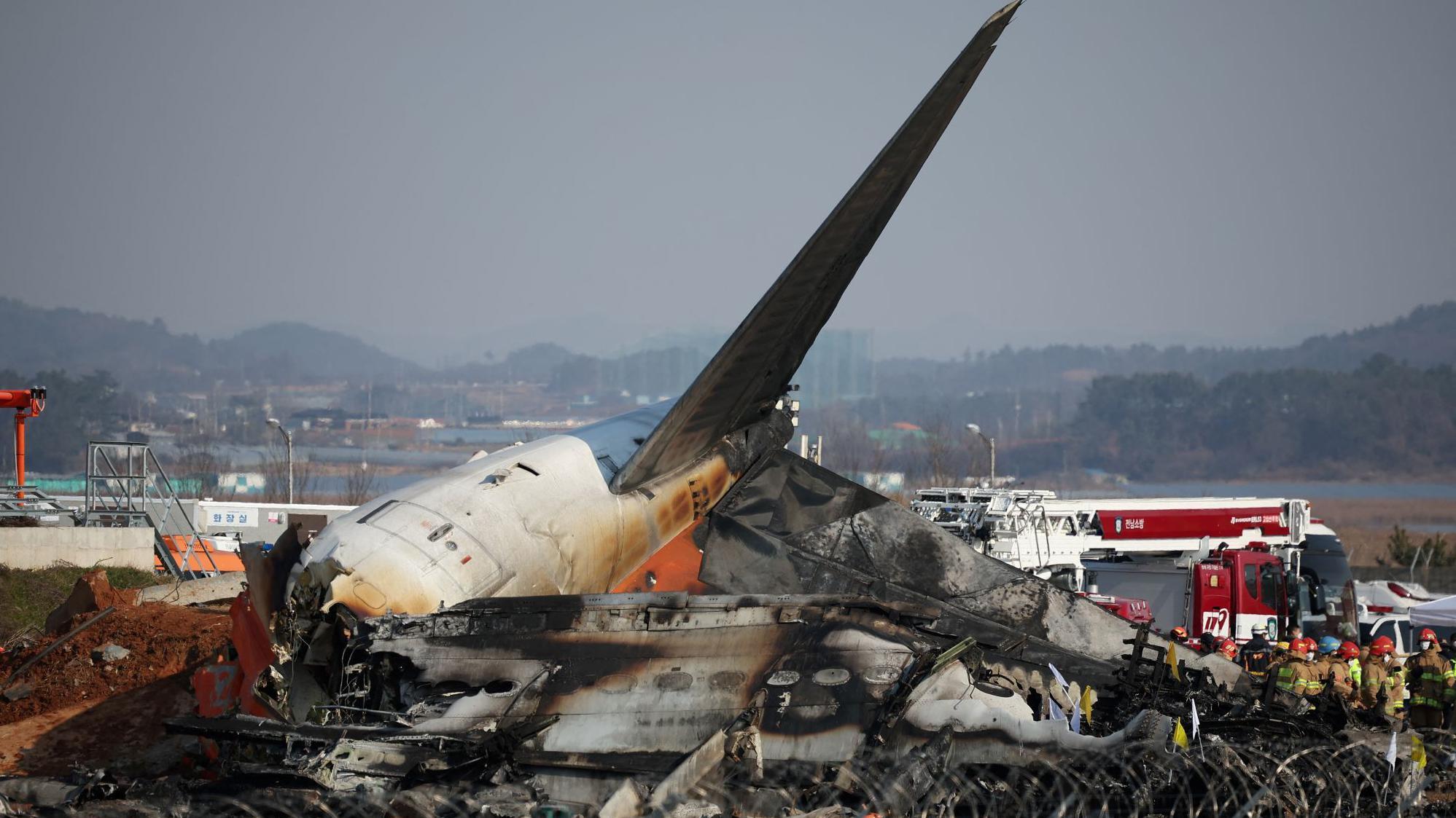 Rescue workers take part in a salvage operation at the site where an aircraft crashed after it went off the runway at Muan International Airport, in Muan, South Korea, December 29, 2024.