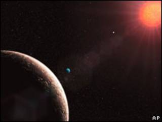 Planeta Gliese 581 E (à esq.)