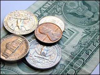 Monedas y billete de dólar estadounidense (US$)