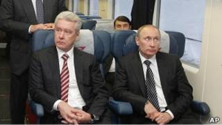 Владимир Путин и Сергей Собянин в бизнес-классе "Аэроэкспресса"