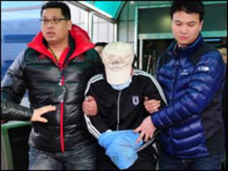 Chinese captain taken away by S Korean officers