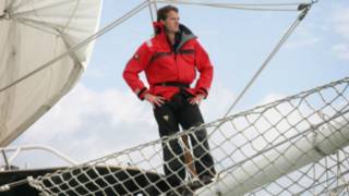 A man standing on a tall ship