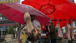 Uighur woman and man in Xinjiang