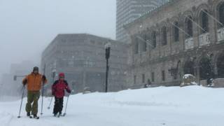 Skiers slide down Boston's Boylston Street