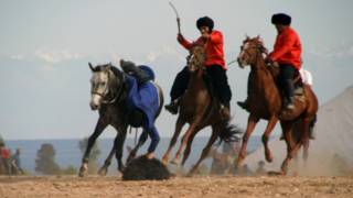 Three men fighting on hourse back