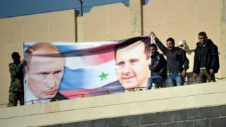Плакат с Путиным и Асадом в Сирии
