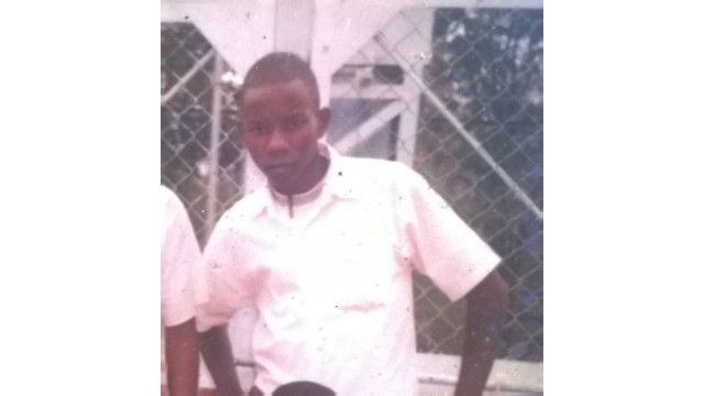 Rashid Mberesero akiwa katika amzingira ya shule baada ya kuhitimu darasa la saba