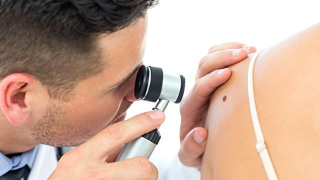A doctor examines a patient