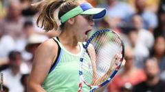 Sofia Kenin celebrates winning a point against Coco Gauff at the Australian Open