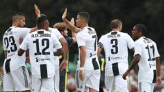 Cristiano Ronaldo (centre) celebrates with his teammates after opening the scoring for Juventus