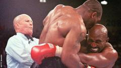 Mike Tyson bites Evander Holyfield's ear in 1997