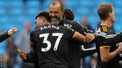 Adama Traore celebrates with Wolves boss Nuno Santo