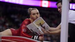 Ellie Black had Simone Biles' autobiography theatrically snatched out of her hands by her coach
