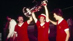Tommy Smith (left)