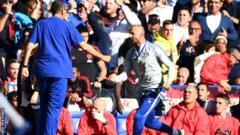 Chelsea coach Marco Ianni runs past the Manchester United bench after Ross Barkley's equaliser