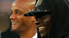 Kompany's former City teammate Mario Balotelli (right) was at the match but did not play