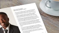 Copy of a CV on a desk next to a cup of tea