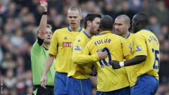 Stoke City's Ricardo Fuller and Andy Griffin clash