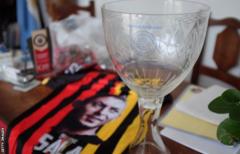 Commemorative cup, with Liga Emiliano Sala branding, and San Martin shirt paying tribute to Sala